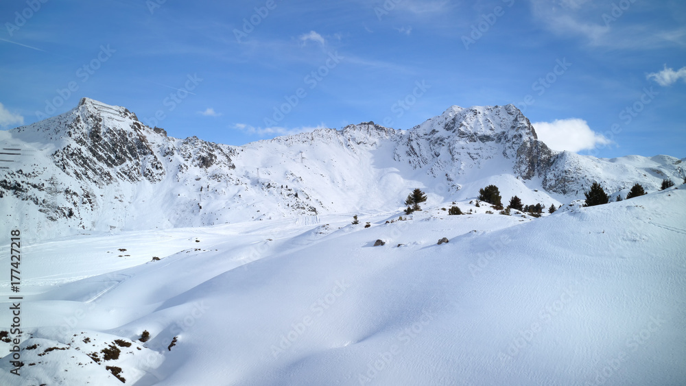 Alpine peaks covered with fresh snow in skiing resort of Les Arcs, France .