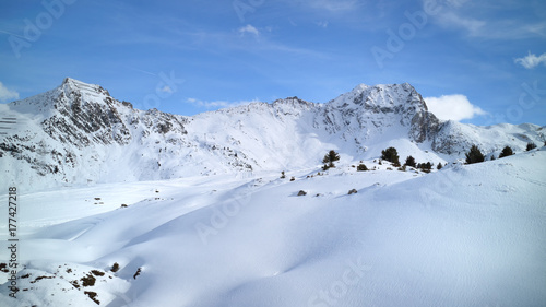 Alpine peaks covered with fresh snow in skiing resort of Les Arcs, France .