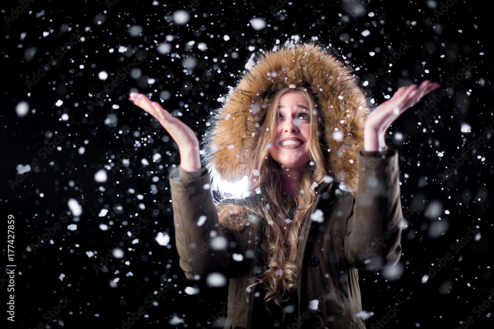 Cheerful girl in snow