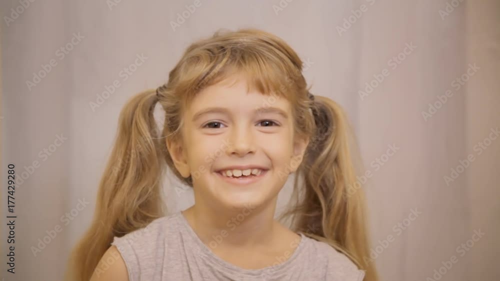 A happy lovely smiling little girl covering her face with the hands. Child's game, playing, peek-a-boo.
A happy lovely smiling little girl covering her face with the hands. Child's game, playing, peek-a-boo.