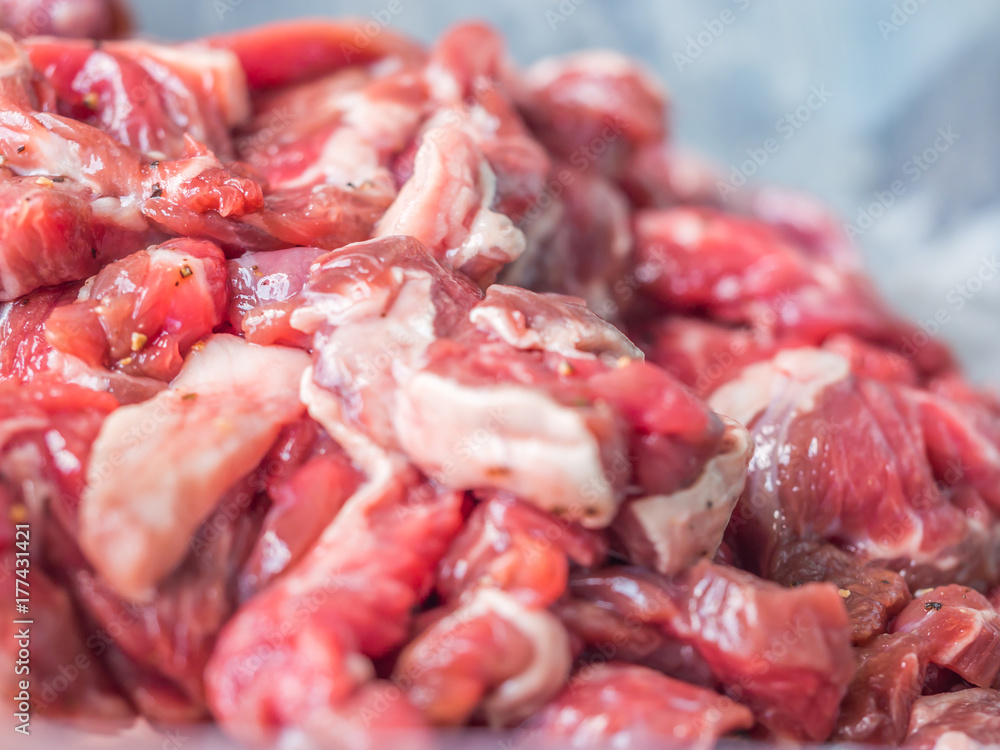 Closeup of raw beef was sliced for cooking. Closeup of raw beef was sliced for cooking.