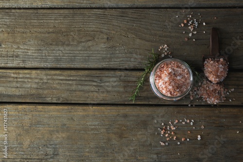 Himalayan salt and rosemary on wooden table