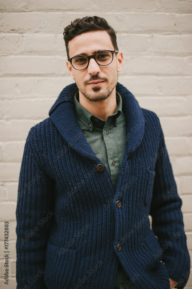 Attractive and fashionable young man wearing glasses Attractive and fashionable young man wearing glasses