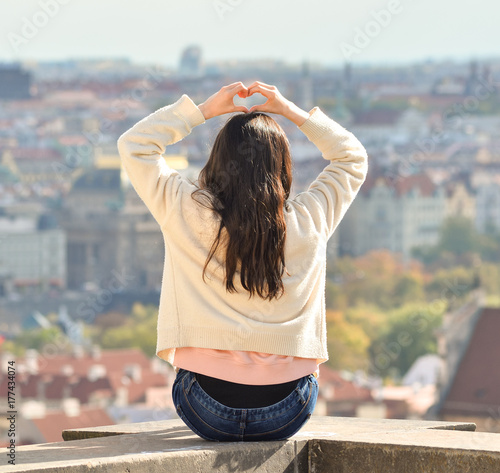 Canvas Print Prague, Czech Republic - October 10, 2017: Pretty Asian girl poses and looks at
