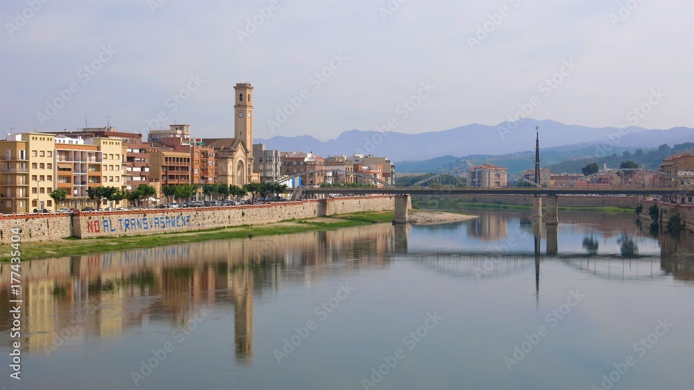 Tortosa, Catalonia, Spain riverside buildings reflected in River Ebro