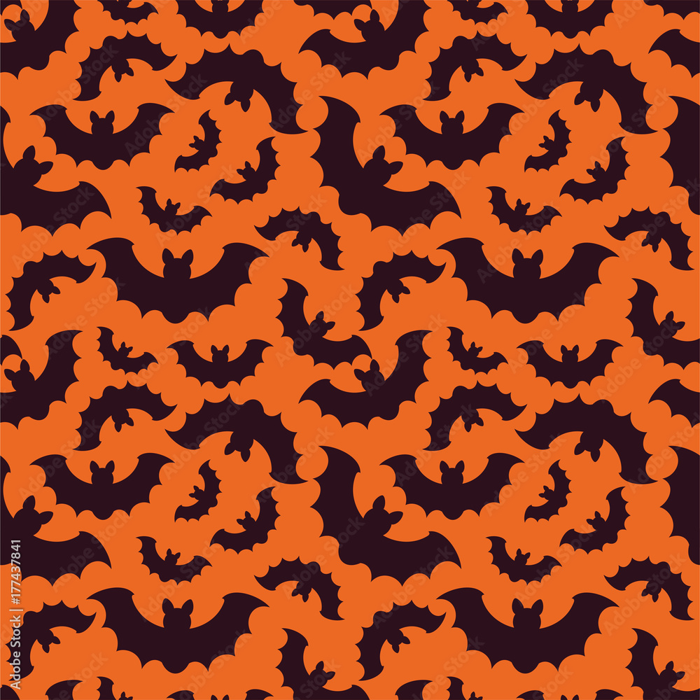 Silhouettes of bats on orange background. Seamless pattern . Halloween background