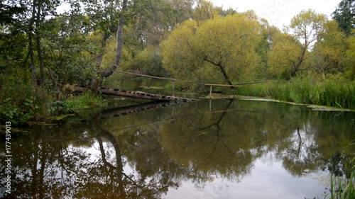 Old bridge over the river at dawn  photo