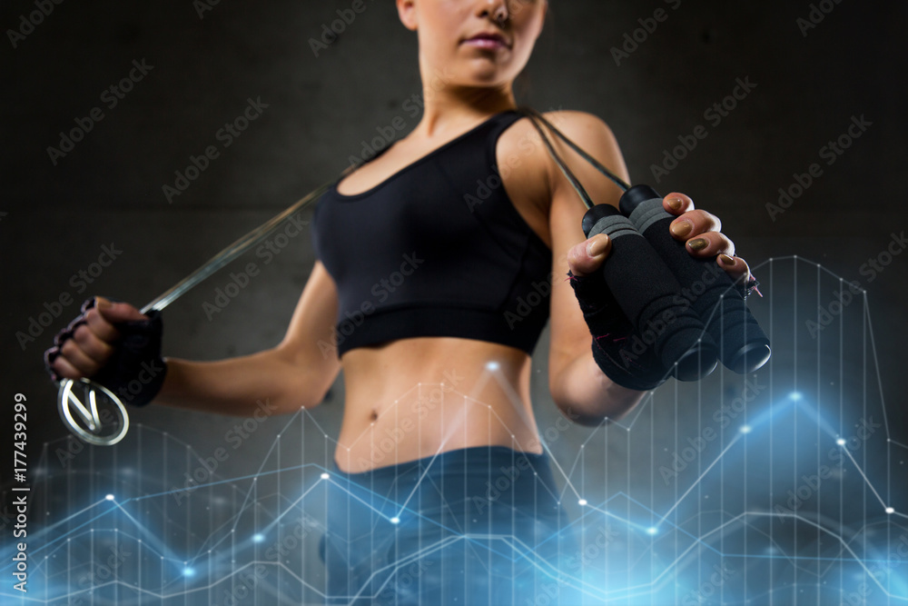 Obraz premium sporty woman with jumping rope