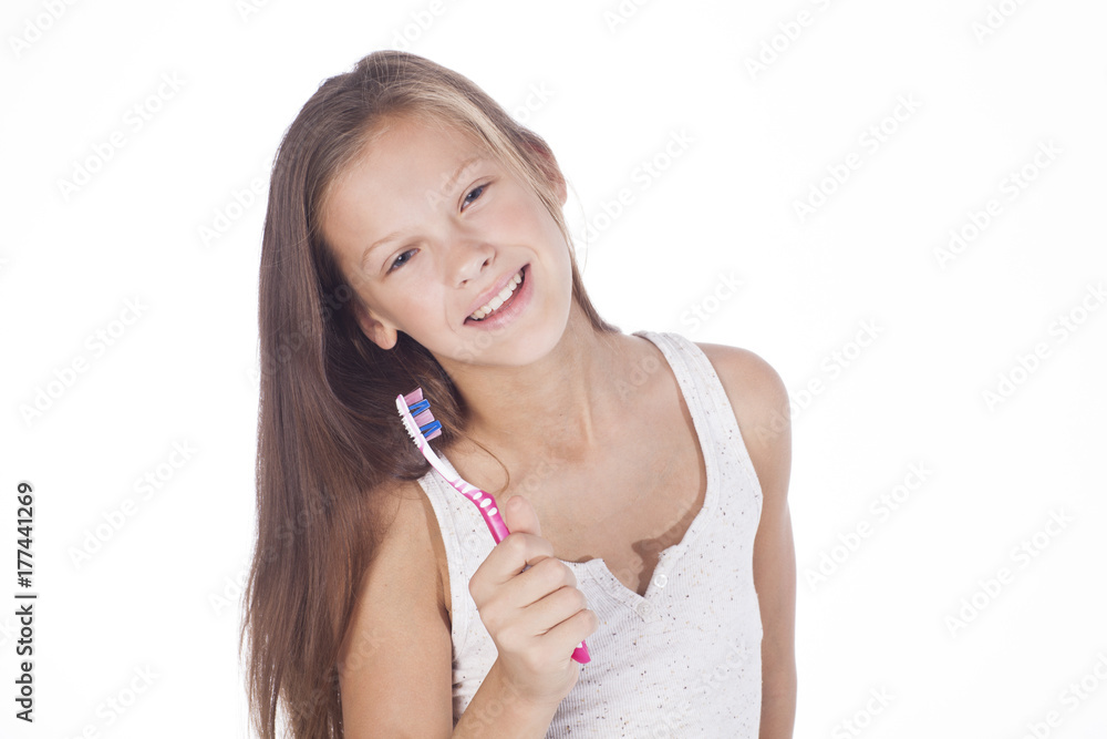 Young pretty girl is brushing her teeth. Young pretty girl is brushing her teeth.