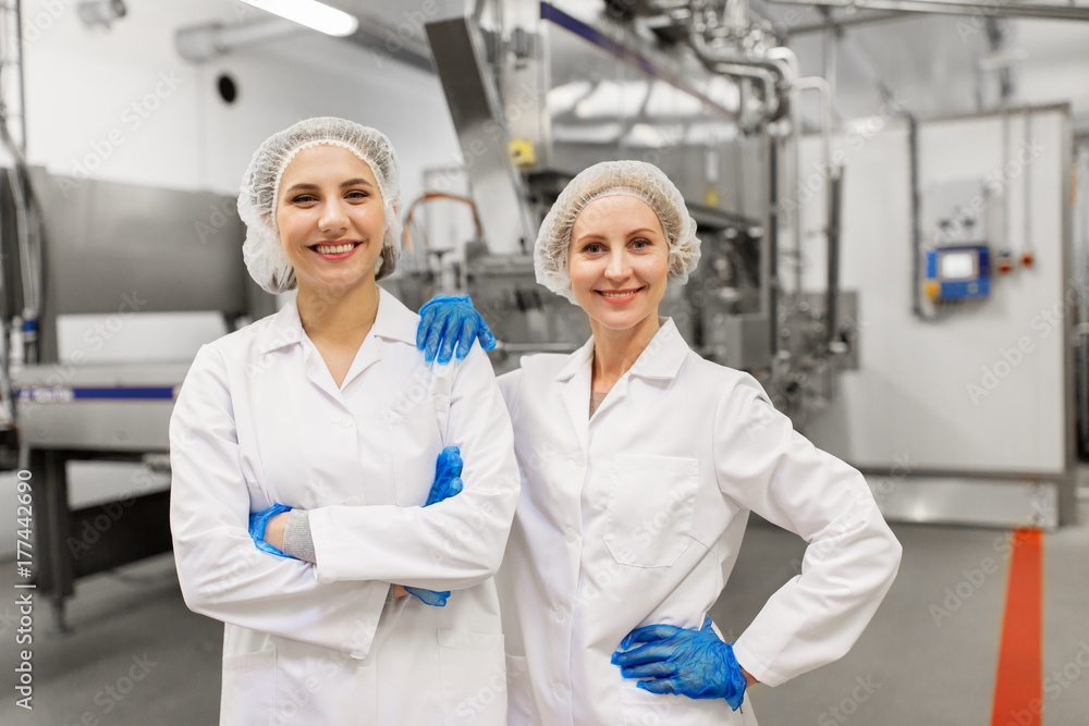 happy women technologists at ice cream factory happy women technologists at ice cream factory