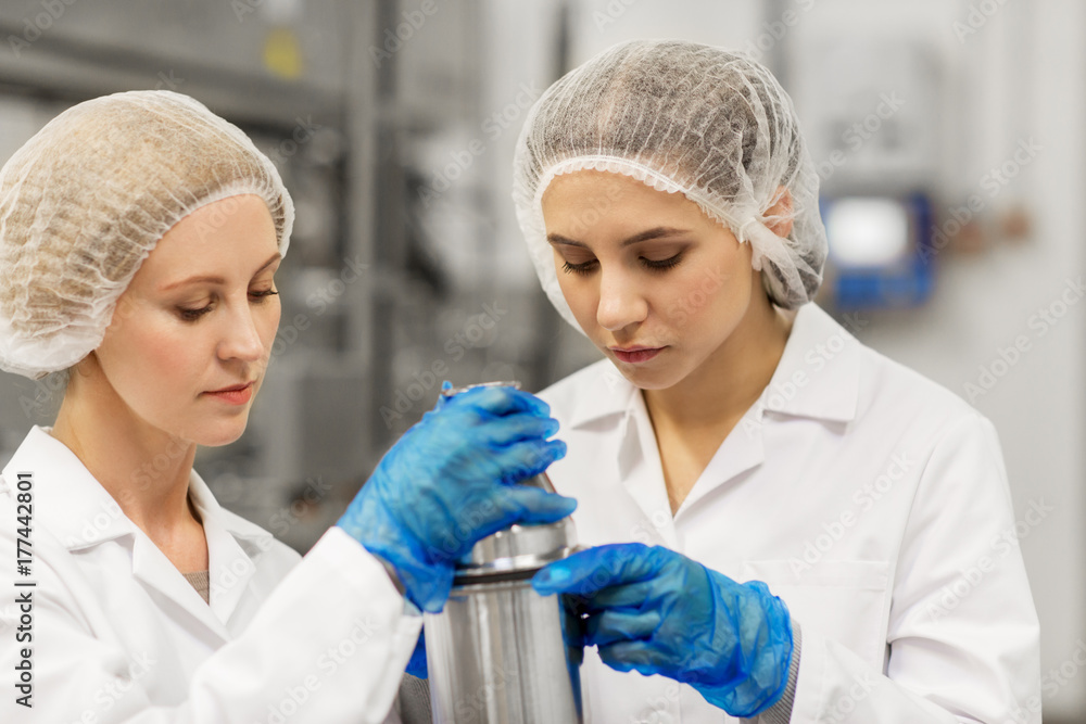 women technologists working at ice cream factory women technologists working at ice cream factory
