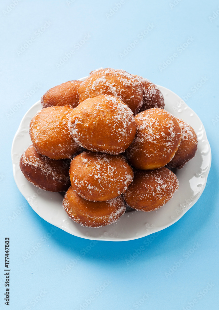 donuts filled with jam, marmalade or cream on a plate