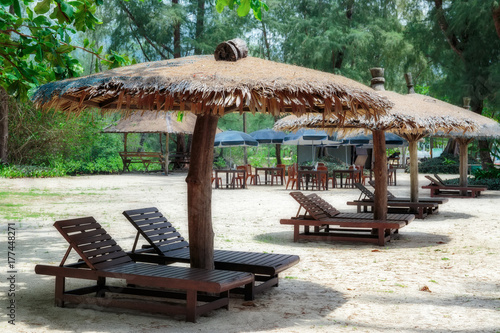 Lounge chairs and sunshade umbrella on the beach