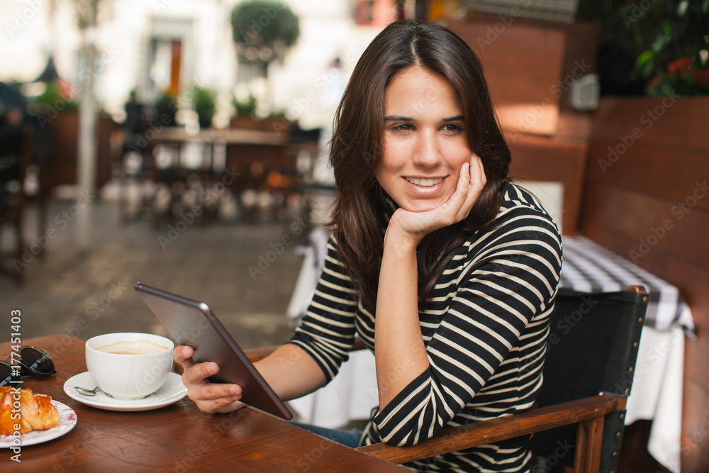 Casual businesswoman working in a terrace of coffee shop. Casual businesswoman working in a terrace of coffee shop.
