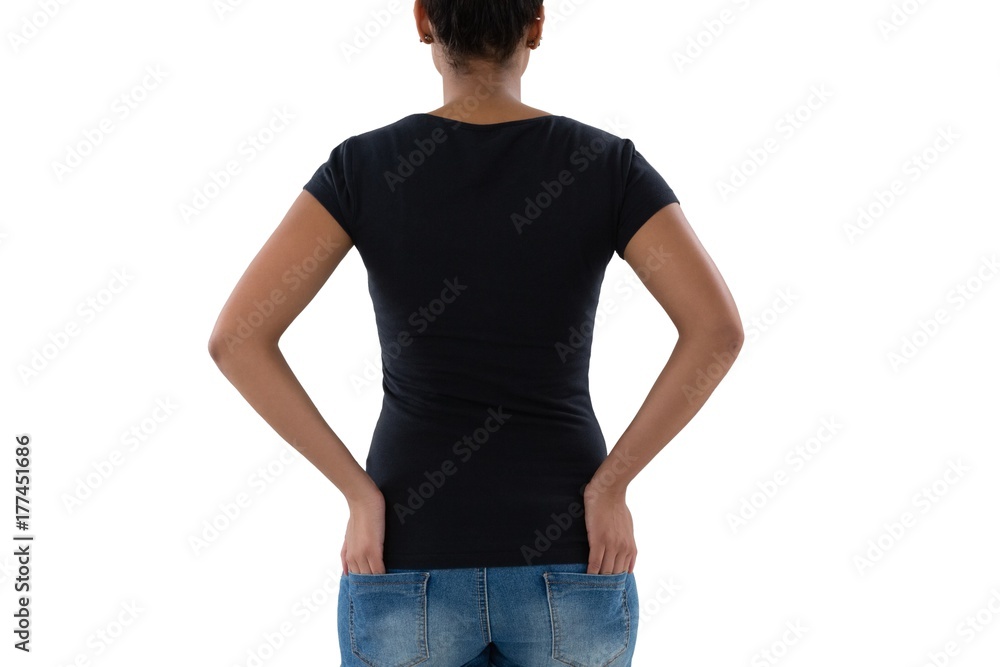 Rear view of woman with hands in pockets Rear view of woman with hands in pockets