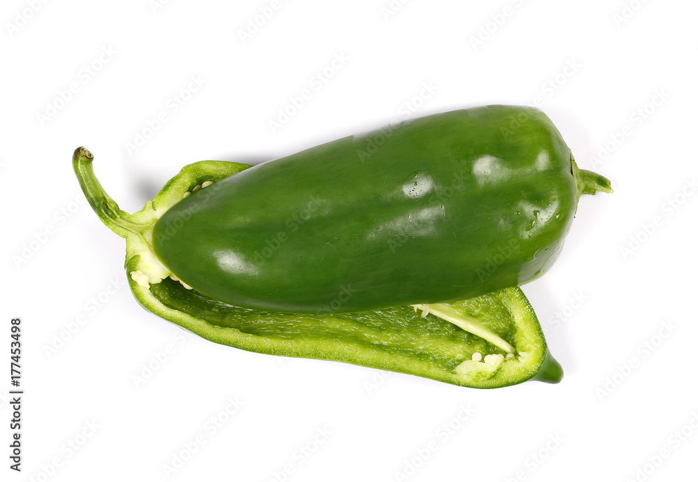 green pepper cut in half, slice isolated on white background, top view green pepper cut in half, slice isolated on white background, top view
