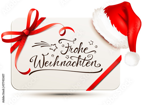 Karte mit roter Schleife, Nikolaus Mütze und Kalligraphie - Frohe Weihnachten