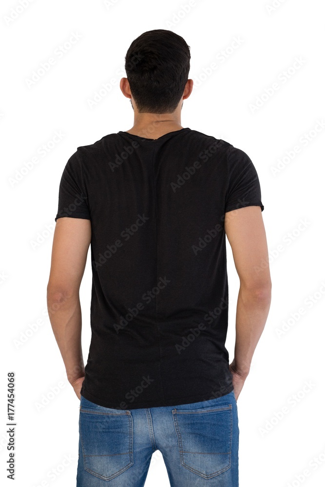 Rear view of man standing with hands in pocket Rear view of man standing with hands in pocket