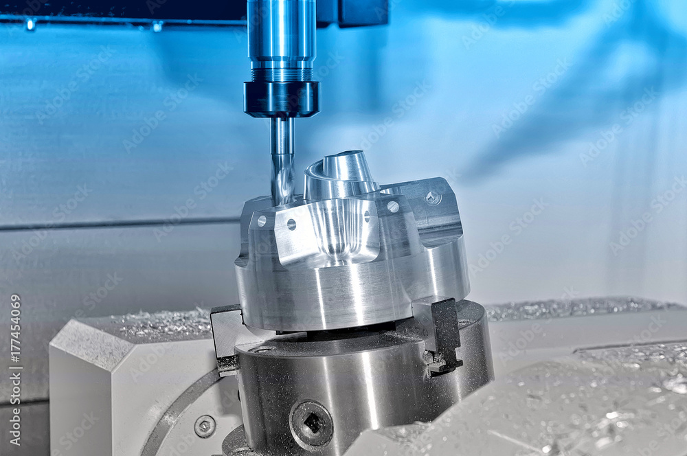 Metal billet in an industrial milling machine. Blue toning. Metal billet in an industrial milling machine. Blue toning.