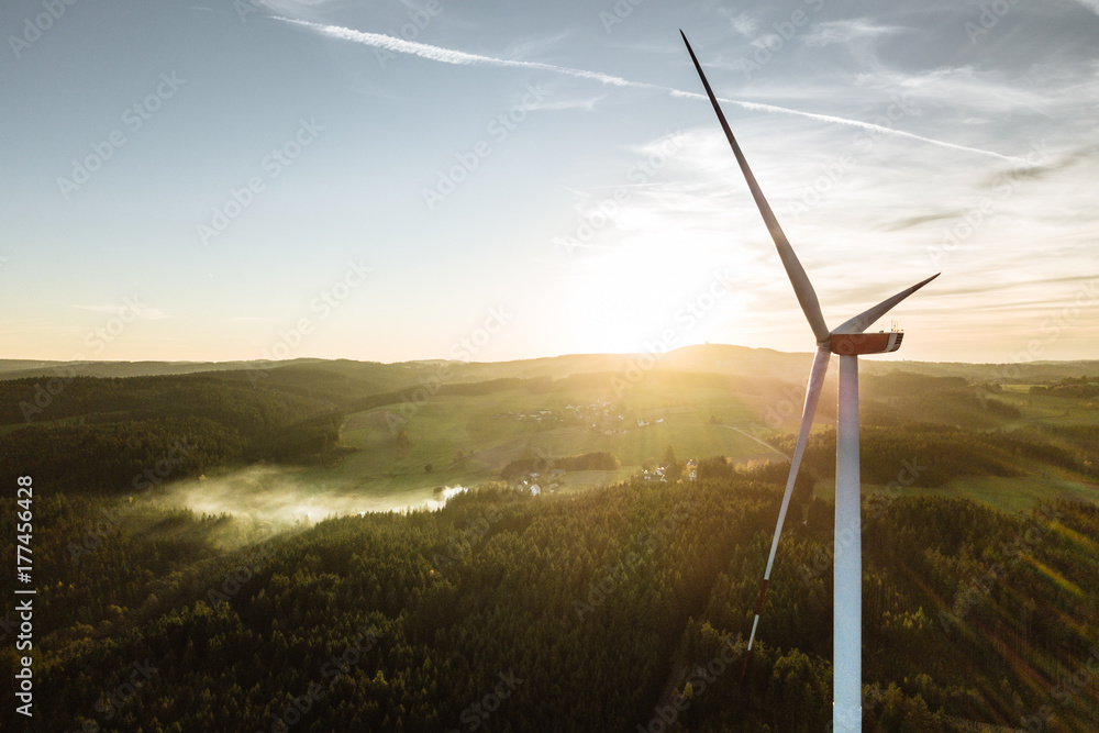 Wind Turbine in the sunset seen from an aerial view - obrazy, fototapety, plakaty 