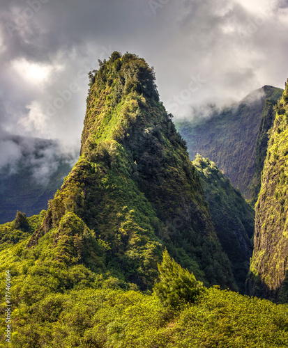 Iao Valley is a very scenic valley in the heart of the West Maui mountains in Hawaii. The central ridge appears to be coming out of the valley  it is known as the Iao Needle