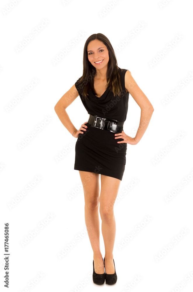 Beautiful smiling young woman, wearing a black dress and posing for camera, in a white background Beautiful smiling young woman, wearing a black dress and posing for camera, in a white background