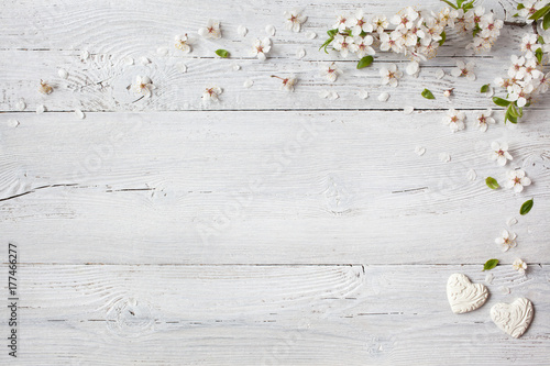 Fototapeta Naklejka Na Ścianę i Meble -  Background with hearts and blooming branches cherry, plum