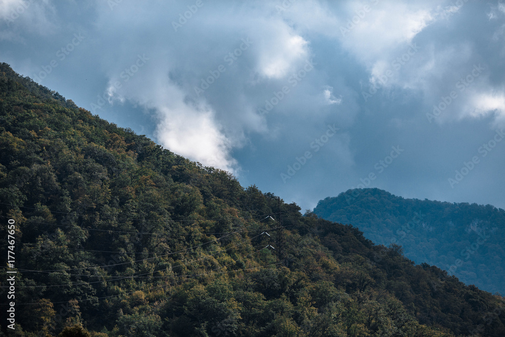 beautiful mountains against the background of dark clouds beautiful mountains against the background of dark clouds