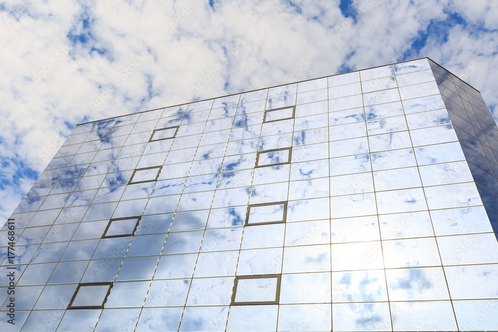 Blue clouds and sun are reflected in the glasses of windows of a modern building. Right view Blue clouds and sun are reflected in the glasses of windows of a modern building. Right view