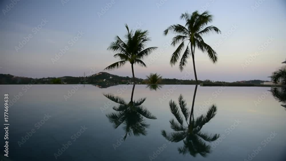 Tropical private pool near the sea at sunset Tropical private pool near the sea at sunset