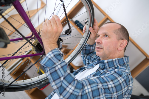 business owner repairing bicycle