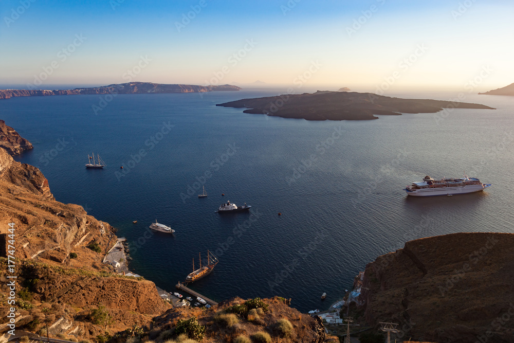 Oia caldera over Aegean sea at sunset, Santorini island. Oia caldera over Aegean sea at sunset, Santorini island.