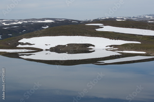 Landscape at the lake Guolasjávri, water reflection, Norway, summer  photo