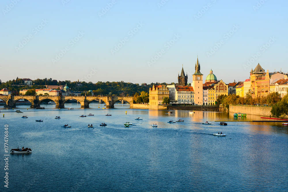 Cityscape of Prague old town, its towers, Vltava river, Charles bridge, St. Francis of Assisi church. One of the most famous areas of Czech Republic capital Cityscape of Prague old town, its towers, Vltava river, Charles bridge, St. Francis of Assisi church. One of the most famous areas of Czech Republic capital
