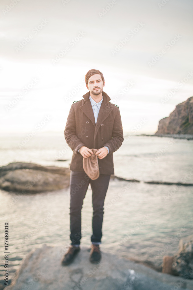 Tilt-shift (selective focus) portrait of man on the coast. Tilt-shift (selective focus) portrait of man on the coast.