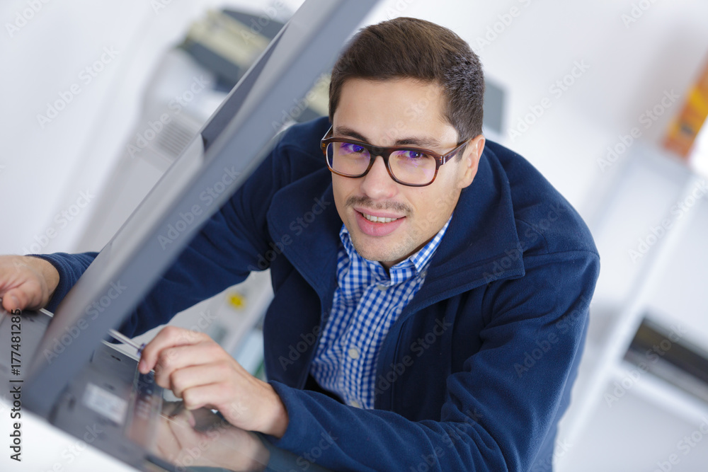 young handsome man scanning documents young handsome man scanning documents