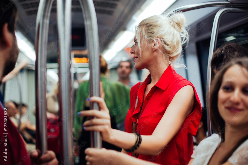 © lumina/Stocksy - Blonde Woman on the Subway © lumina/Stocksy - Blonde Woman on the Subway
