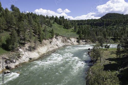 green rushing waters of the Yellowstone River in Wyoming