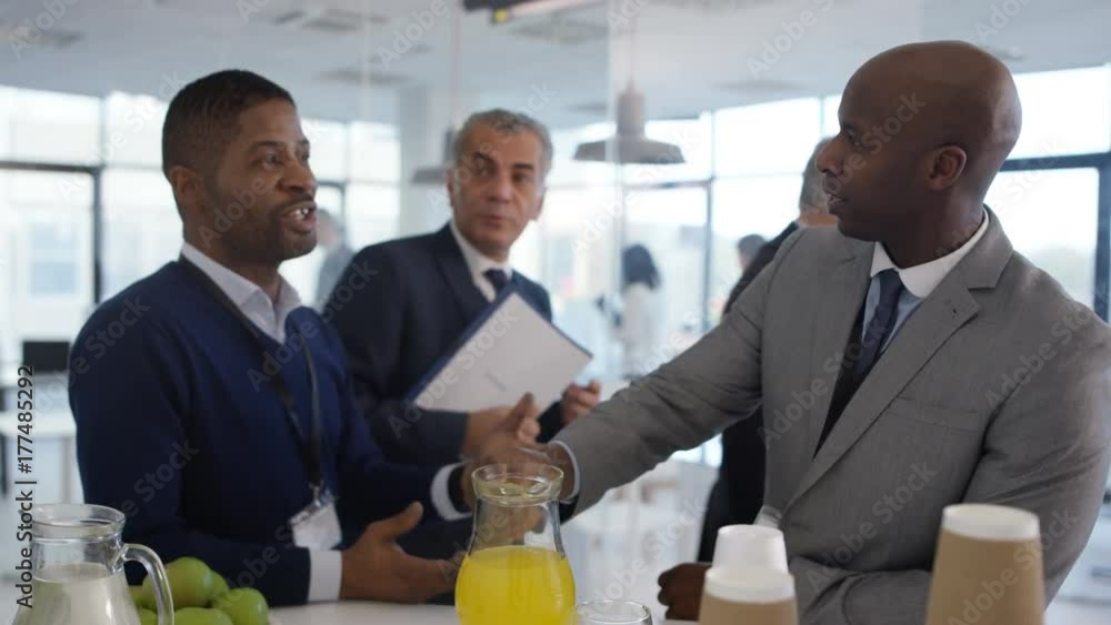 Management group at a business seminar, talking & networking Management group at a business seminar, talking & networking