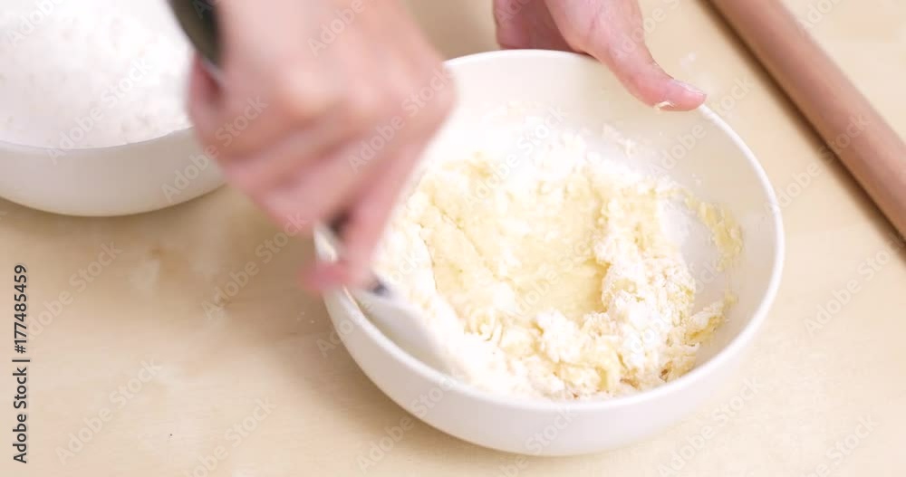 Mixing dough in bowl Mixing dough in bowl