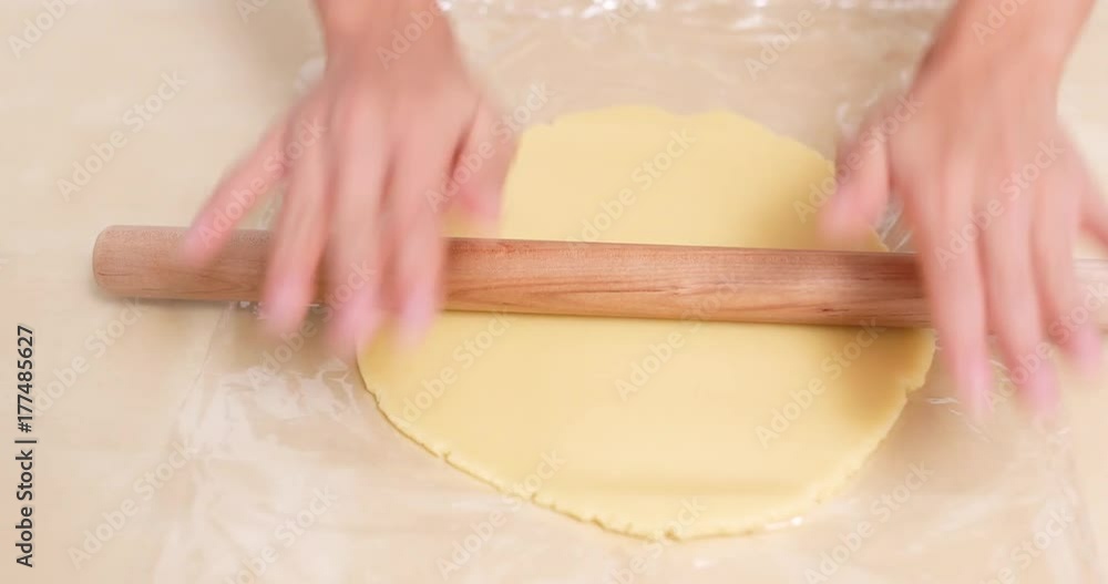 Chef rolling dough with rolling pin Chef rolling dough with rolling pin