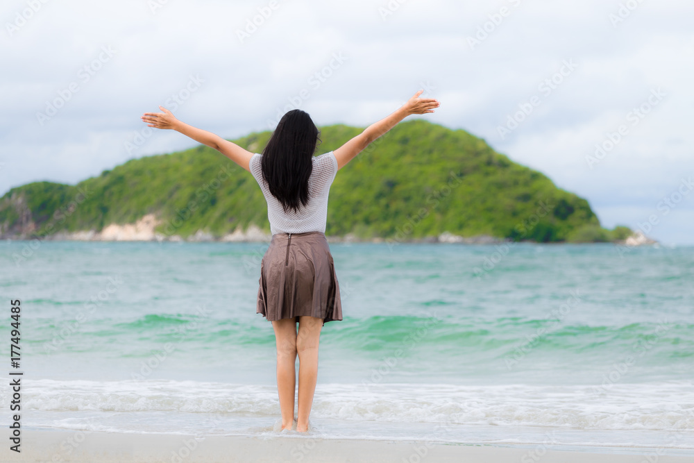 Beautiful Asian woman vacation on beach of Thailand