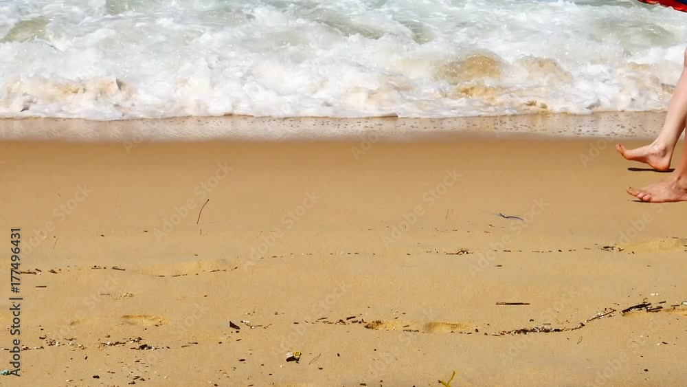Close up shot foot walk on the beach in relaxation and travel concept, UHD or 4K Resolution. Close up shot foot walk on the beach in relaxation and travel concept, UHD or 4K Resolution.