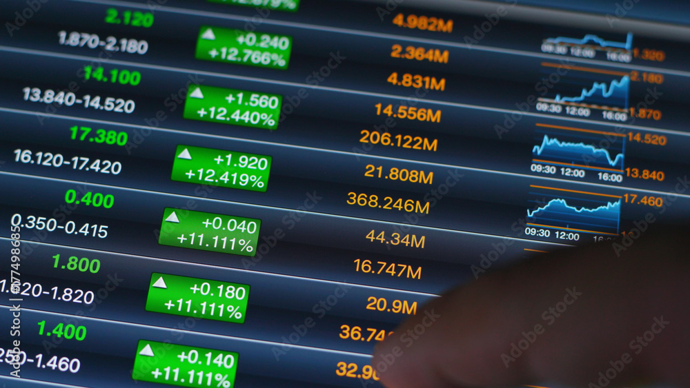 Fototapeta premium Man checking stock market on tablet