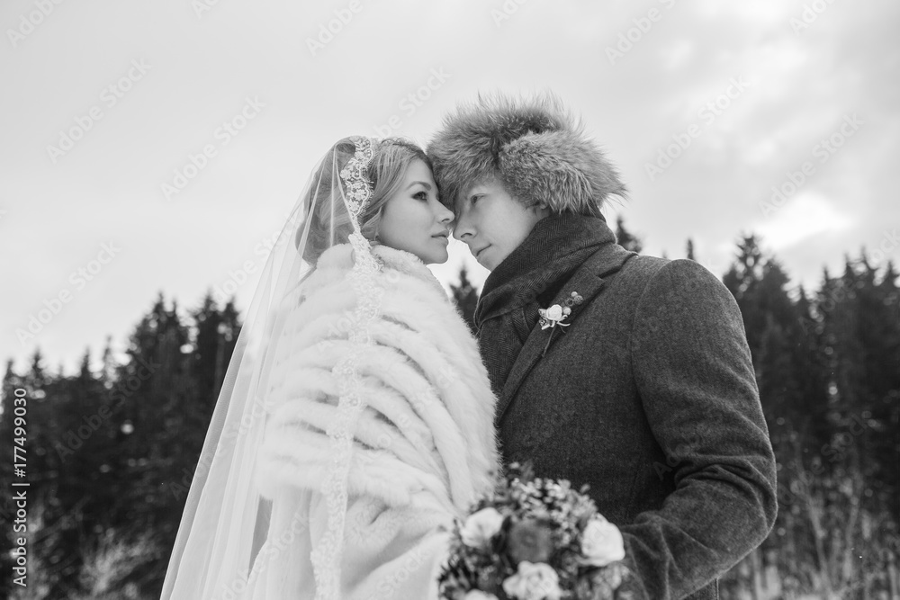 Lovers bride and groom on their winter wedding Lovers bride and groom on their winter wedding