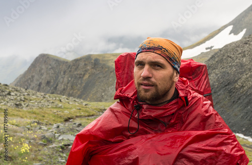 Handsome young man tourist backpacker portrait on Himalaya mountain view