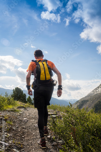 Man trail running in the mountain in Altai, Russia