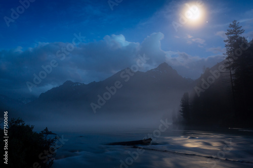 Wonderful Kucherlinsky lake At night under the moon that is at the foot of the Belukha mountain, Altai Mountains, Russia