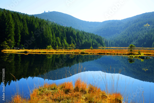 Moraine lake Kleiner Arbersee with mount Gross Arber in National park Bavarian forest. Autumn landscape in Germany.