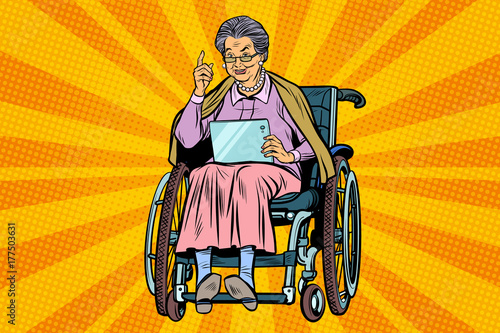 elderly woman disabled person in a wheelchair, gadget tablet